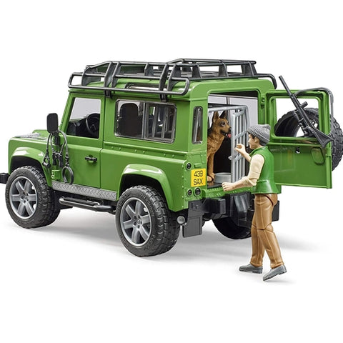 Bruder - Masina de Teren Land Rover Defender cu Padurar si Caine